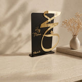 luxury black matte and gold acrylic haj mabroor stand by Hams