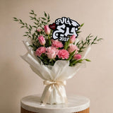 Luxury graduation bouquet with acrylic topper reading "خالي احلى خريج" for celebrating maternal uncle graduation in UAE